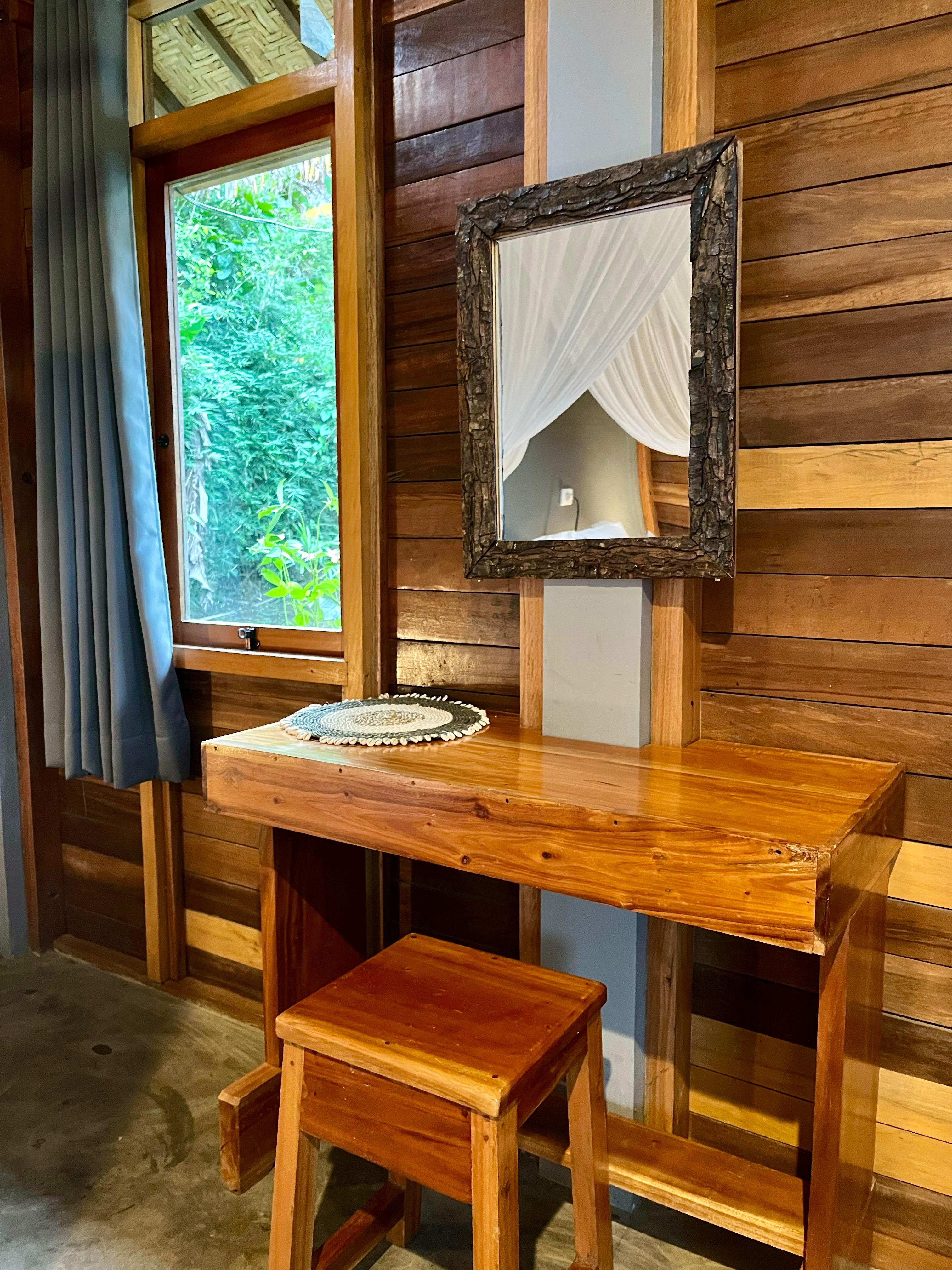 Handmade wooden desk and mirror inside bungalow