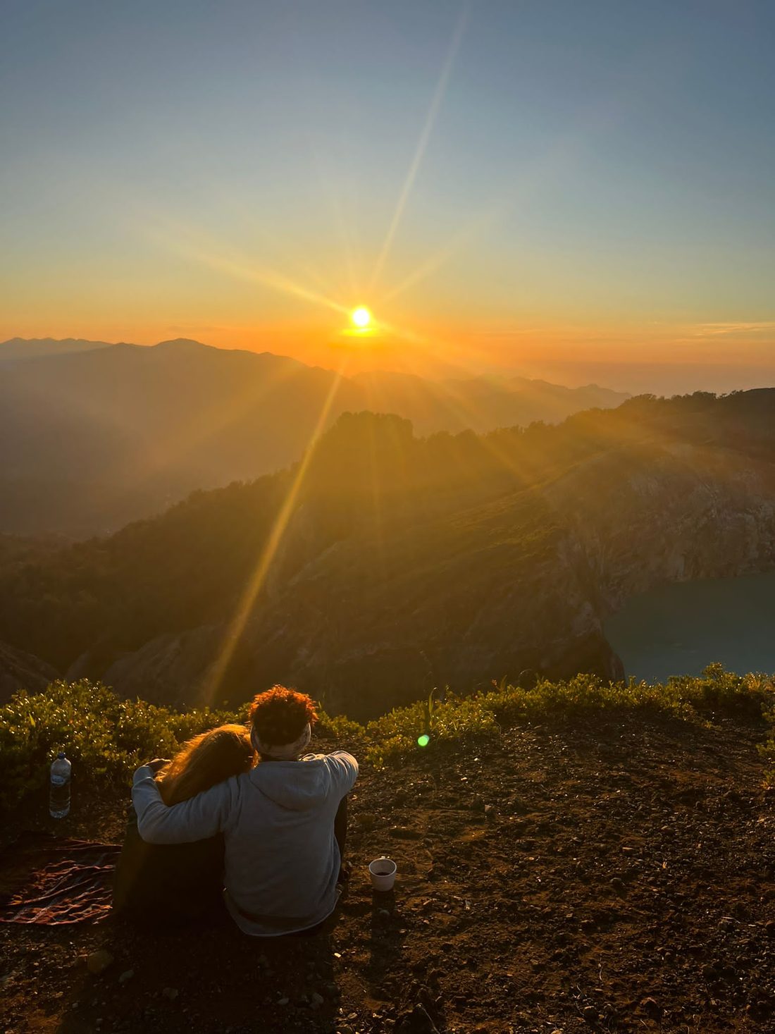 Lopez and Simone at the rim of Kelimutu at sunrise